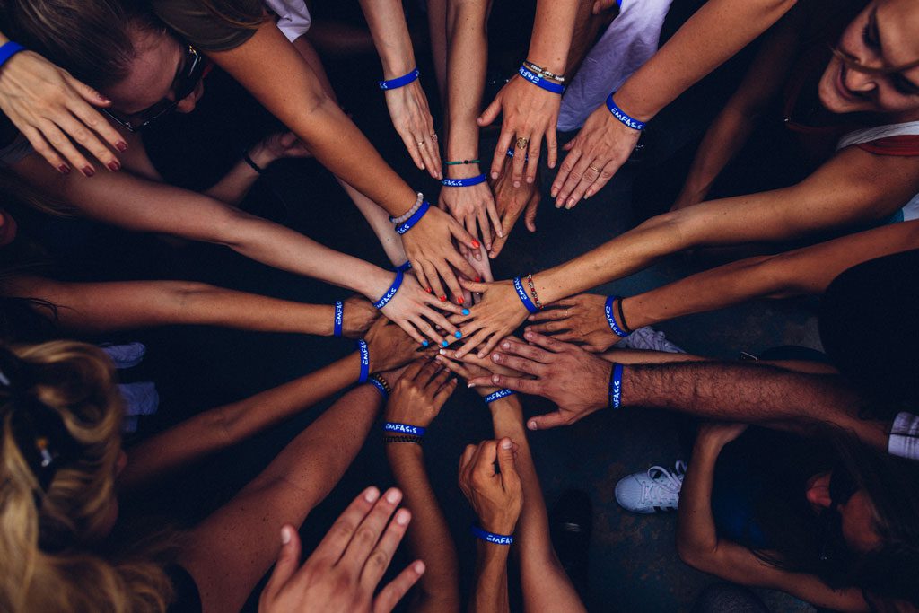 perry-grone-lbLgFFlADrY-unsplash many hands, charity program 1point3creative